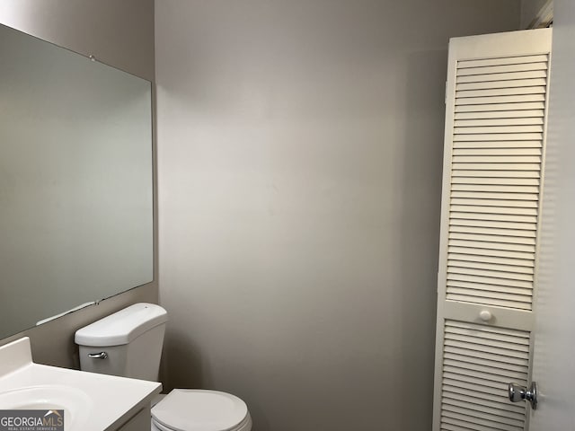 6268 Marbut Farms Trl, Lithonia, GA 30058 - half bathroom featuring toilet and vanity