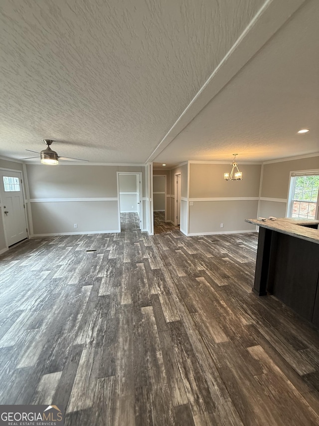 132 Wauka Mountain Rd, Clermont, GA 30527 - unfurnished living room featuring wood finished floors, a chandelier, baseboards, and a ceiling fan