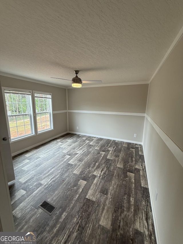 132 Wauka Mountain Rd, Clermont, GA 30527 - spare room with wood finished floors, a ceiling fan, a textured ceiling, and baseboards