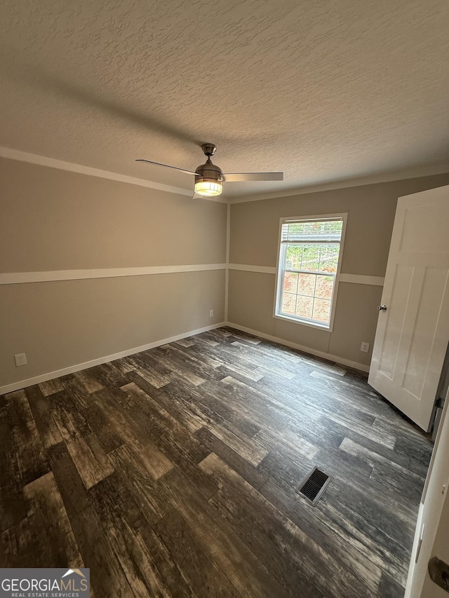 132 Wauka Mountain Rd, Clermont, GA 30527 - unfurnished room with dark wood-style flooring, a textured ceiling, a ceiling fan, and baseboards