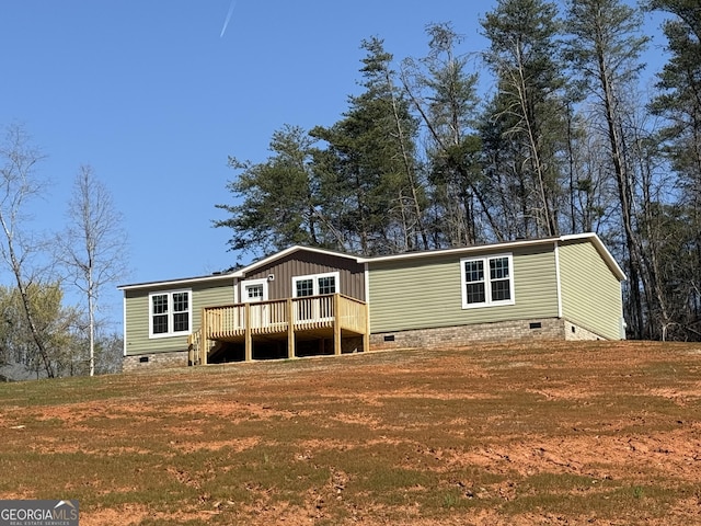 132 Wauka Mountain Rd, Clermont, GA 30527 - view of front facade with crawl space, a deck, and a front lawn