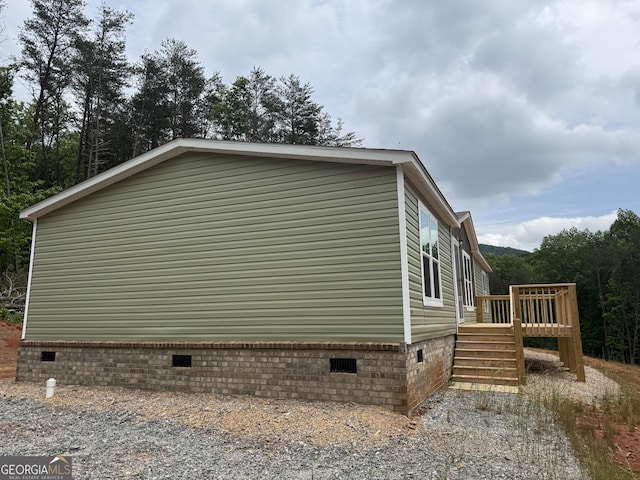132 Wauka Mountain Rd, Clermont, GA 30527 - view of property exterior with crawl space and a deck