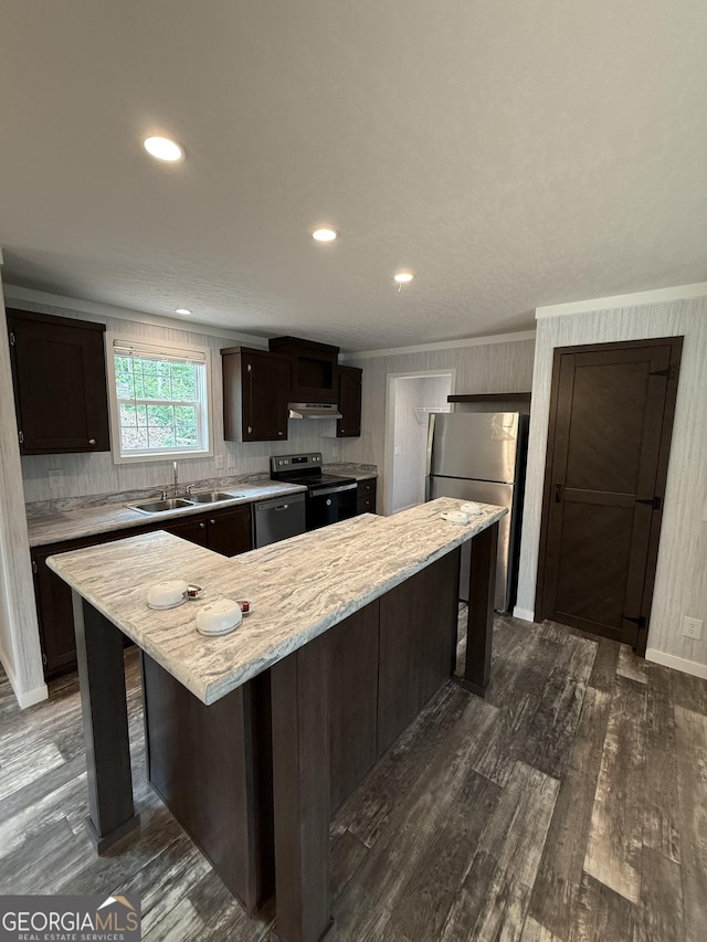 132 Wauka Mountain Rd, Clermont, GA 30527 - kitchen featuring electric range oven, a sink, freestanding refrigerator, dark brown cabinets, and a kitchen bar