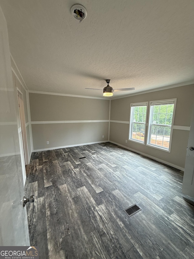 132 Wauka Mountain Rd, Clermont, GA 30527 - spare room with wood finished floors, ceiling fan, a textured ceiling, and baseboards