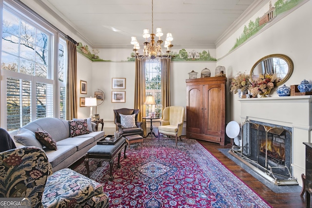 living room featuring dark hardwood / wood-style flooring, crown molding, and a chandelier