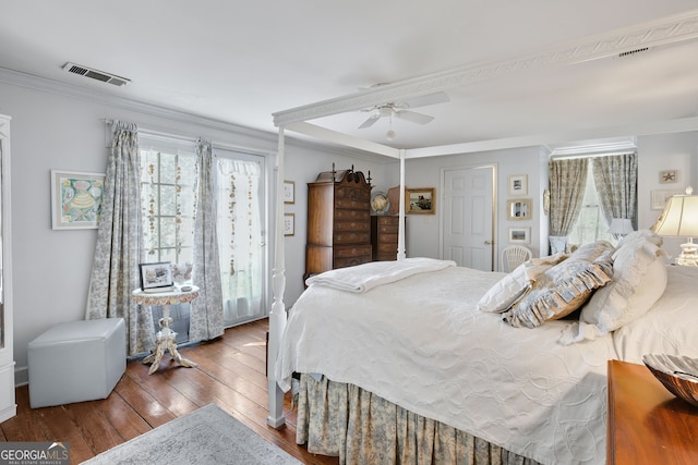 bedroom with ceiling fan, crown molding, and hardwood / wood-style flooring