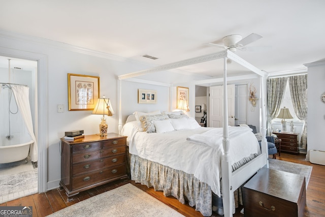 bedroom with ceiling fan, dark hardwood / wood-style flooring, and crown molding