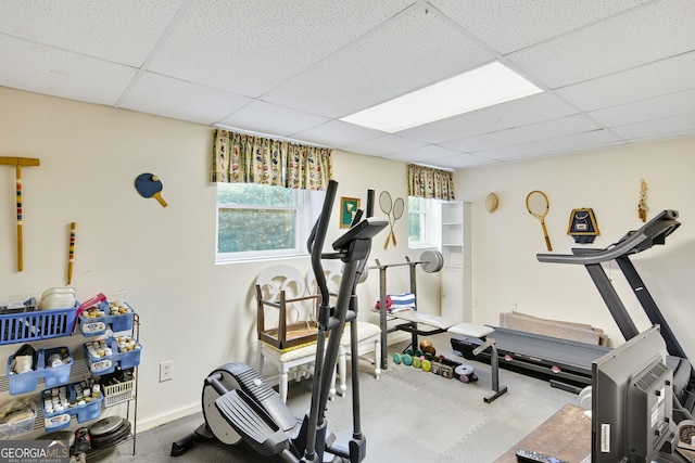 workout room featuring a drop ceiling