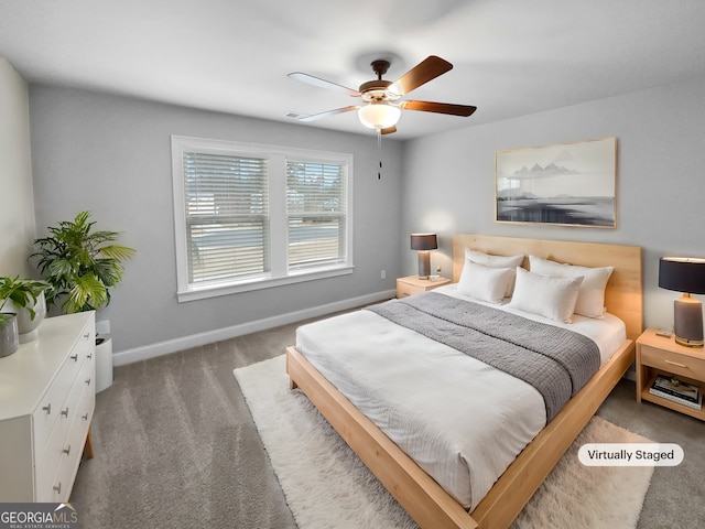 bedroom with ceiling fan and carpet floors