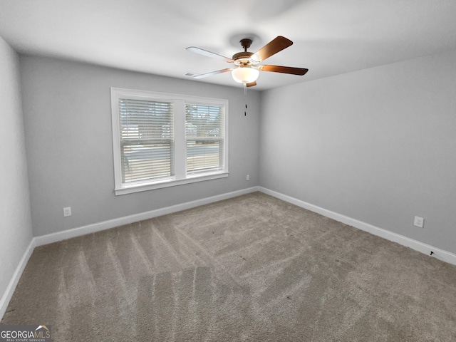 carpeted empty room with ceiling fan