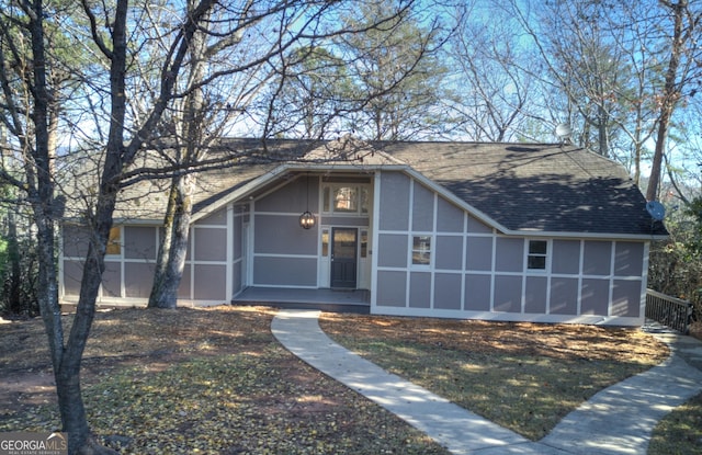 view of front of home featuring a sunroom