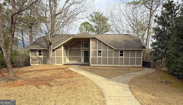 view of front of house featuring a sunroom