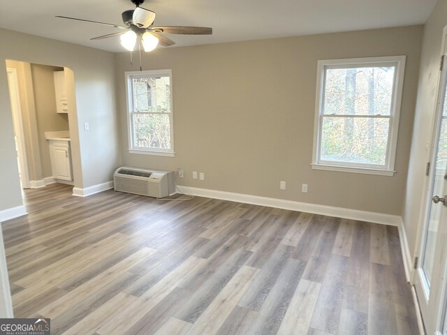 bathroom with hardwood / wood-style flooring, vanity, and toilet