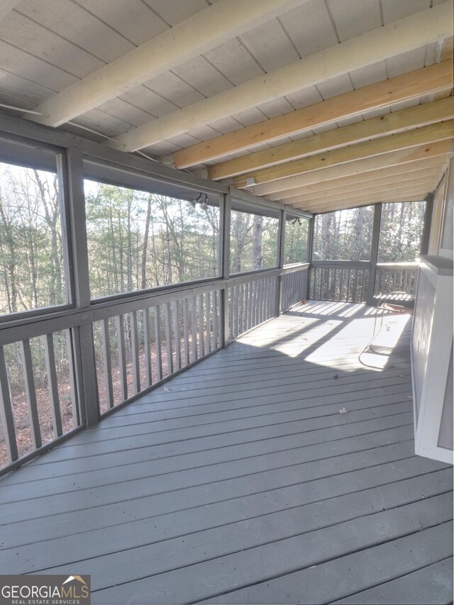 view of front facade featuring a deck and french doors