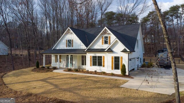 view of front facade featuring a porch and a garage