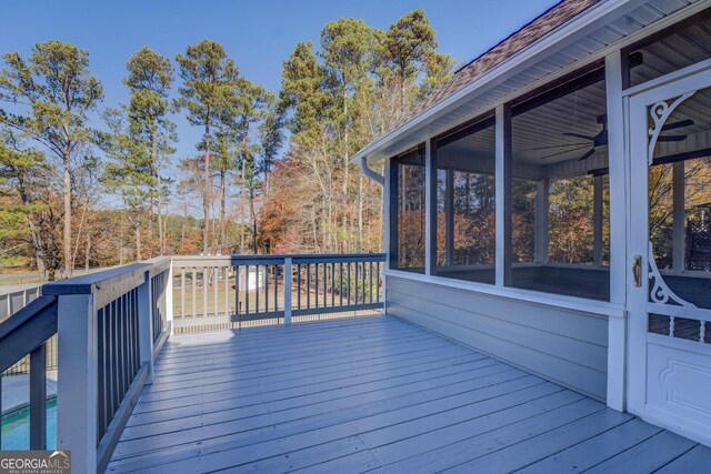 1103 Etowah Valley Ln, Woodstock, GA 30189 - wooden deck with ceiling fan and a sunroom
