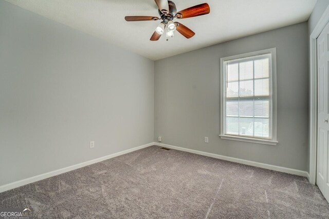 1103 Etowah Valley Ln, Woodstock, GA 30189 - spare room with carpet and ceiling fan