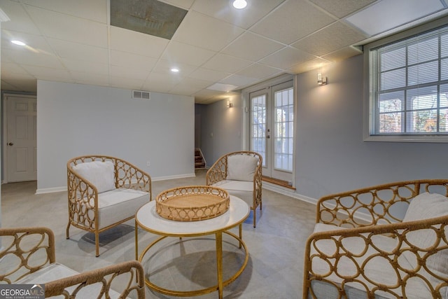 1103 Etowah Valley Ln, Woodstock, GA 30189 - sitting room with light carpet, french doors, and a healthy amount of sunlight
