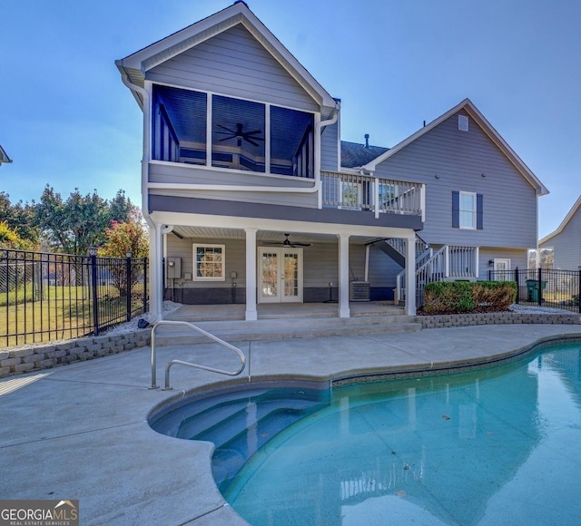 1103 Etowah Valley Ln, Woodstock, GA 30189 - back of property featuring a sunroom, ceiling fan, french doors, a fenced in pool, and a patio