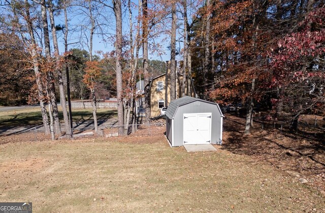 1103 Etowah Valley Ln, Woodstock, GA 30189 - view of yard featuring a storage shed and view of scattered trees