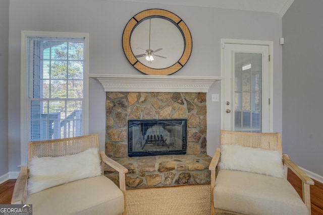 1103 Etowah Valley Ln, Woodstock, GA 30189 - sitting room with hardwood / wood-style flooring, ceiling fan, ornamental molding, and a fireplace