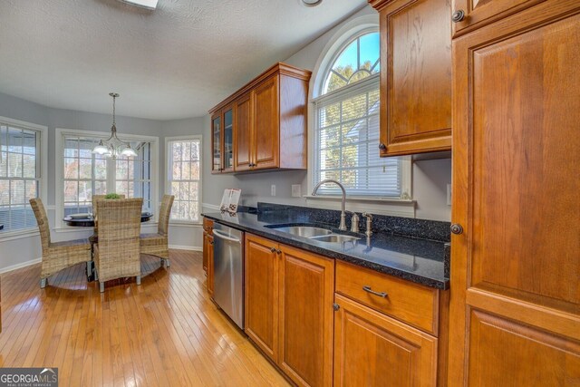 1103 Etowah Valley Ln, Woodstock, GA 30189 - kitchen with dishwasher, sink, plenty of natural light, and an inviting chandelier