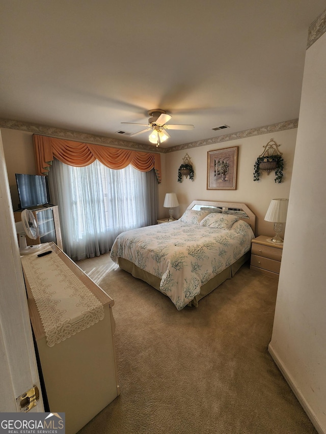 carpeted bedroom featuring ceiling fan