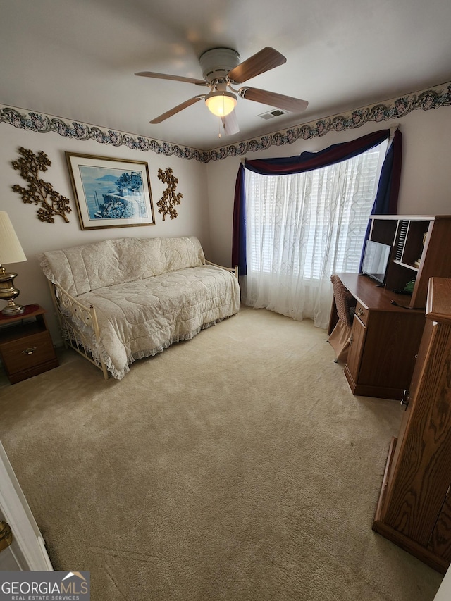 bedroom with ceiling fan and carpet floors