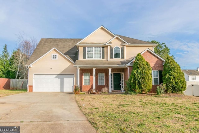 view of front of home with a garage and a front lawn