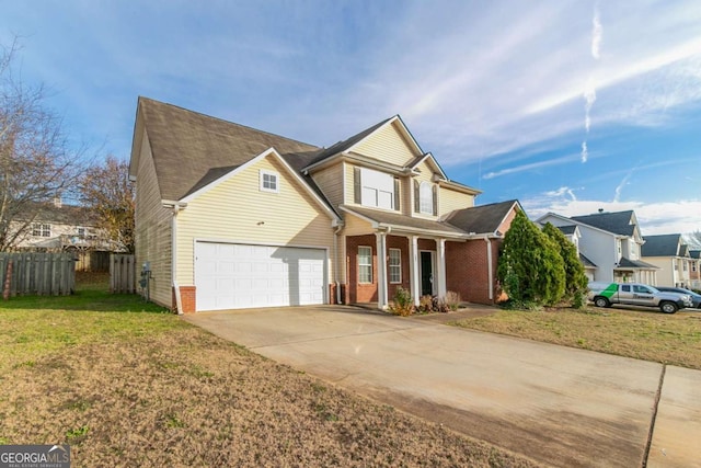 view of front of home with a front yard and a garage