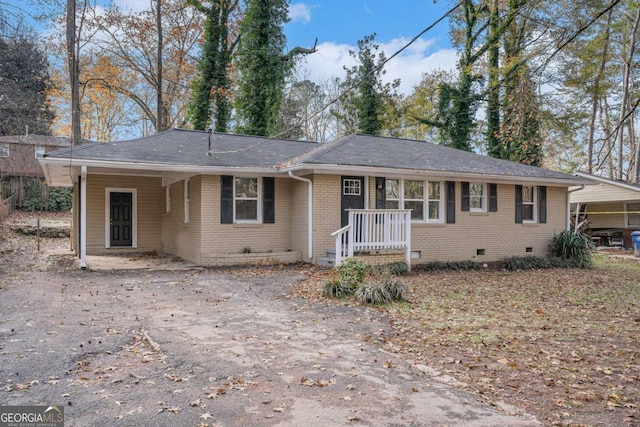 ranch-style house featuring a carport