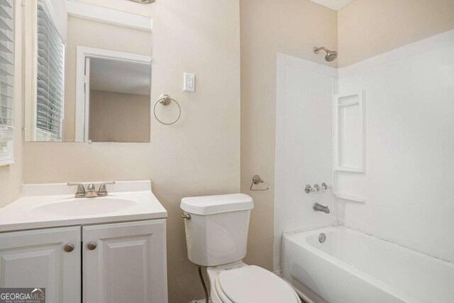 full bathroom featuring vanity,  shower combination, and toilet