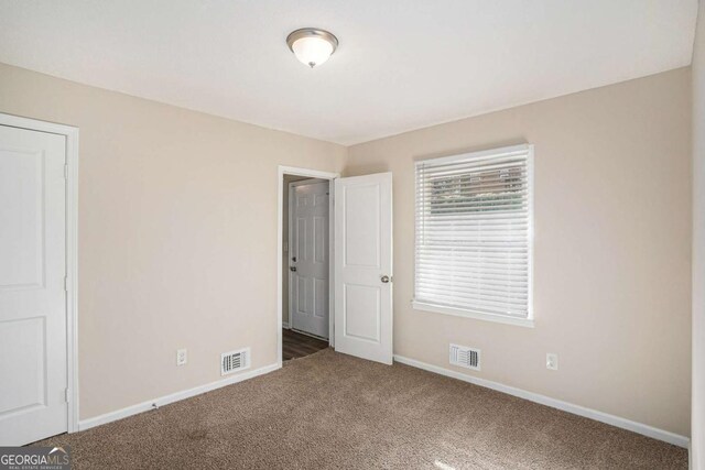 unfurnished bedroom with carpet floors