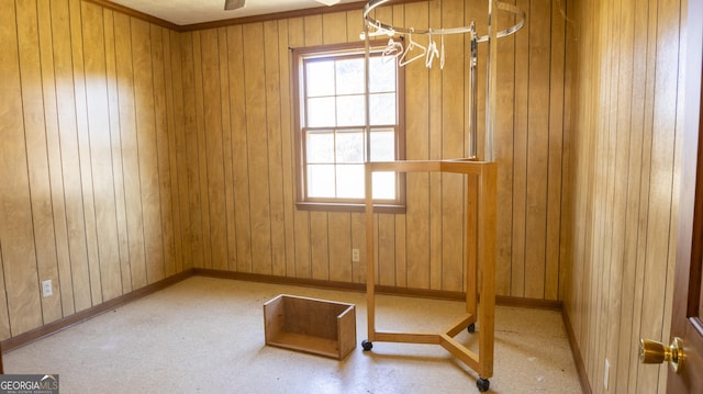 empty room featuring wood walls