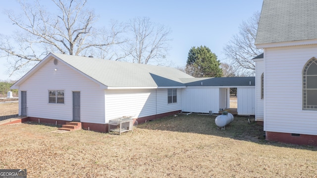 view of property exterior featuring a lawn