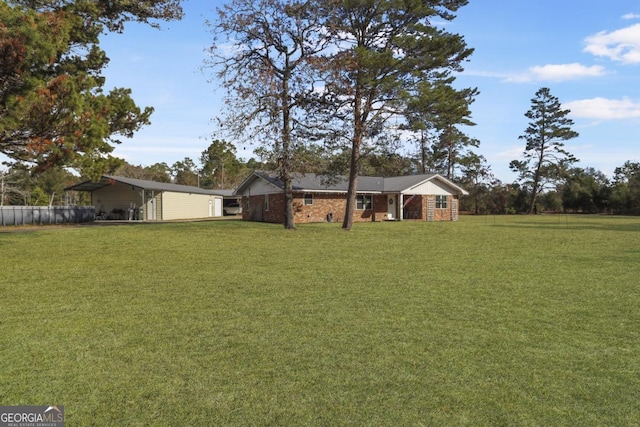 view of yard with a detached carport