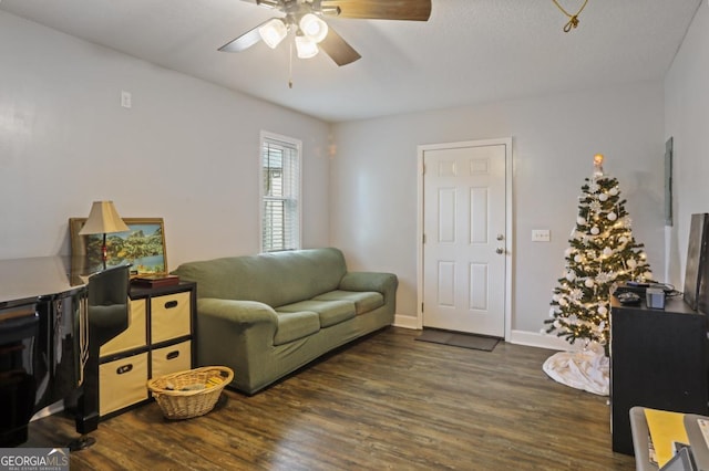 living room featuring dark hardwood / wood-style floors and ceiling fan