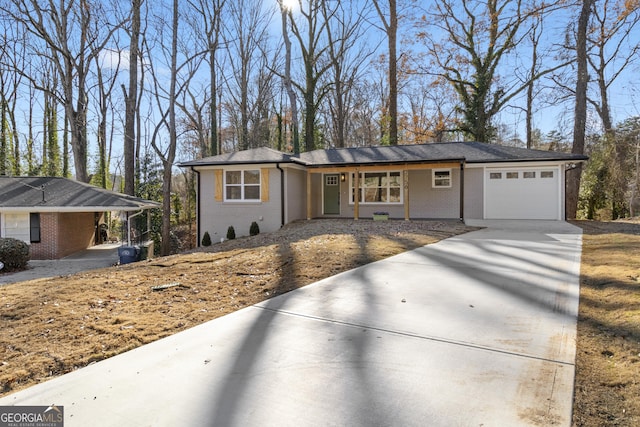 view of front facade with a garage and a carport