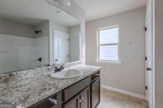 bathroom with vanity and walk in shower