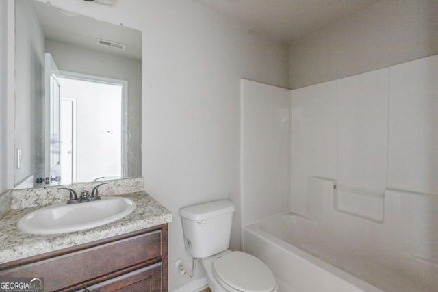 full bathroom with shower / bathing tub combination, vanity, toilet, and plenty of natural light