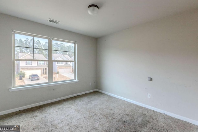 unfurnished room with carpet flooring