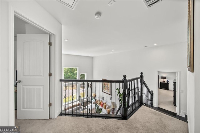 hallway with light carpet