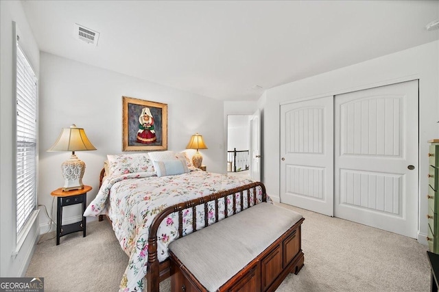 carpeted bedroom featuring a closet