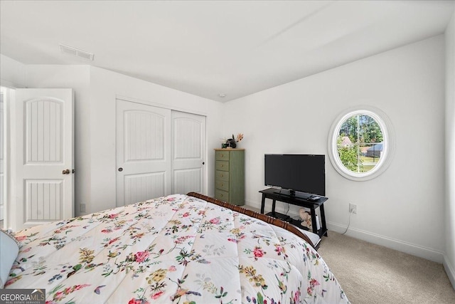 bedroom with carpet floors and a closet