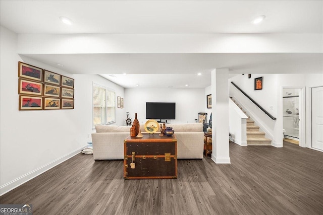 living room featuring dark wood-type flooring