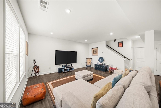 living room featuring dark wood-type flooring