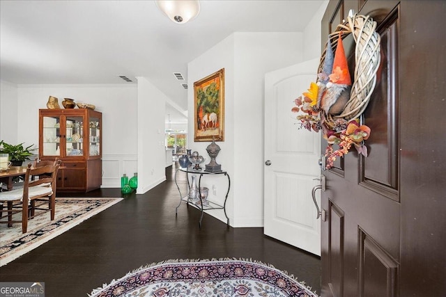 entryway with dark wood-type flooring