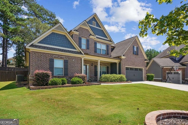 craftsman inspired home with a front yard, a garage, and cooling unit