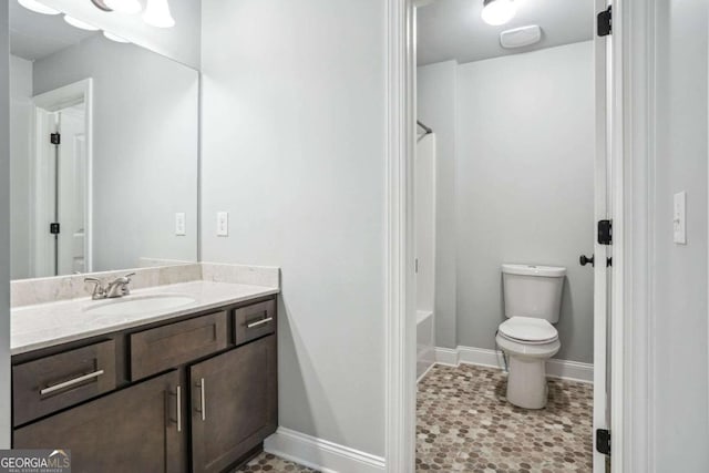 full bathroom with vanity,  shower combination, and toilet