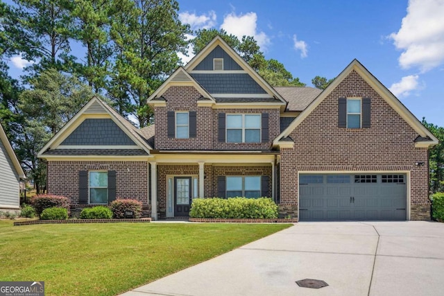 craftsman-style house featuring a front yard and a garage